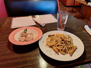 Pink potato salad and lemon picatta pasta with vegan chicken at Vida Cafe in Fort Worth