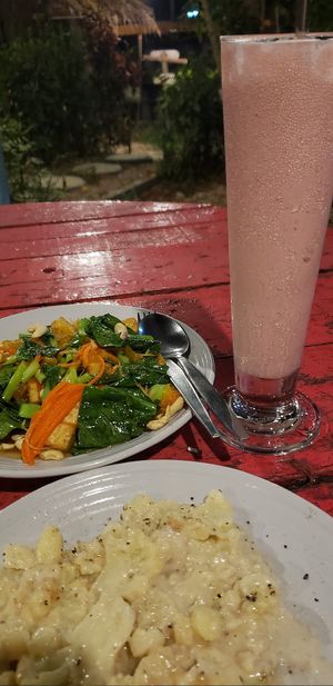 Vegan cheesy cauliflower. Ginger orange tofu Strawberry milkshake (choice of milk: soy, coconut, or rice). All vegan. This is too much food for 1 person: need 2 when very hungry at Cha Chai Home in Koh Phayam