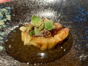 Seared cabbage, smoked tomato broth, caramelized onion and croutonss  at Wolfs Junge in Hamburg