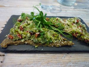 The delicious pesto pizza! at Nama Artisan Raw Foods in West London