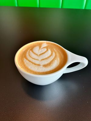 Beautiful latte art on my pumpkin spice oat milk dirty chai 🥰  at ContempoRoast Coffee & Roastery in Centerville