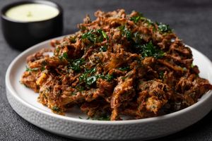 Onion Spinach Fritters at Raw Mango Vegan in Redondo Beach