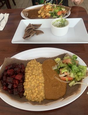 Gurshu combo and Tofu tibs in the back   at Bersi Ethiopian Restaurant in Brooklyn