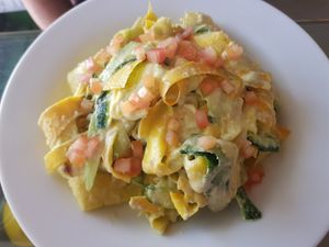 zuccini "pasta" fettuccine in creamy sauce (raw dish) at Carrots - Cloud Kitchen in Bangalore
