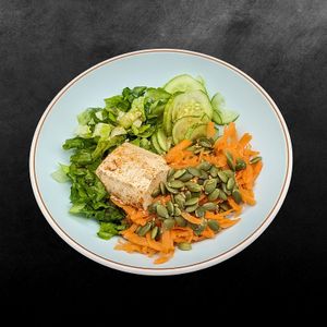 Spice up your day with our Spicy Tofu Salad! 🔥🥗 Crunchy romaine, fresh cucumber, sweet carrot, and crunchy pumpkin seeds, all topped with mouthwatering spicy sesame tofu. at Toss It in Phnom Penh