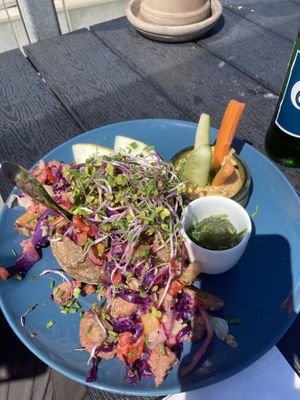 Baked potato with vegetable filling and hummus on the side    at Cafe Møller in Hirtshals