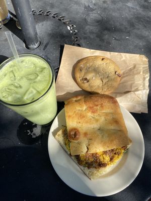 Vegan breakfast sandwich, vegan salted chocolate chip cooked and a matcha latte w/oat milk (I did add agave for sweetness myself )  at Magpie Cafe in Baton Rouge