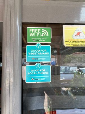 Door sticker from TripAdvisor saying they’re good for vegetarians  at Restorant Leza in Lin