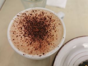 Cappuccino with oatmilk at La Aldea Cafe Bar in Conil De La Frontera