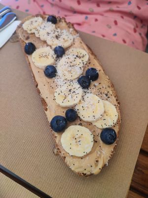Tostada de crema de cacahuete y frutas at La Aldea Cafe Bar in Conil De La Frontera