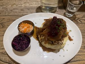 Mash with vegan sausage, caramelized onion gravy, and cranberry saucee  at Makars Mash Bar - Edinburgh in Edinburgh