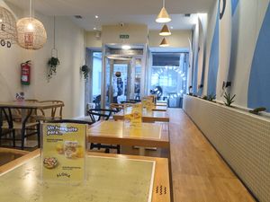 Indoor seating area at Aloha Poké in A Coruna