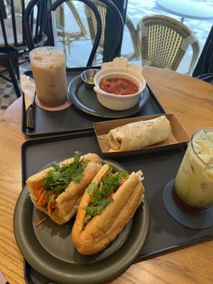 Clockwise from left: Salted Caramel iced latte, tomato soup, chicken wrap, strawberry matcha, banh mi.   at Salon de Vegan in Seoul