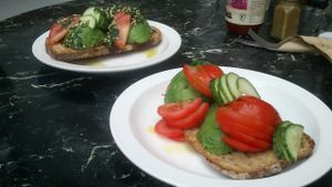 Gallery Cafe, avocado on toast (bare in front, regular with pesto behind) at The Gallery Cafe in East London