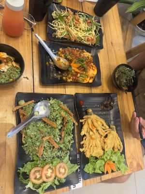 Mango salad, Sichuan tofu, green rice, fried enoki mushrooms   at Quán Chay An in Can Tho