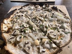 Vegan tarte flambé with soya cream, onions and mushrooms  at Brasserie de la Lanterne in Strasbourg