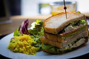 Lunch Set - Hummus Sandwich with Salad, Couscous and carrot cake on the side  at Pure Cafe in Tokyo