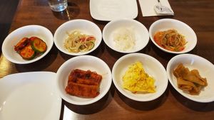 Vegan Banchan: cucumber, bean sprouts, radish, tofu. Not vegan: japchae (fish sauce), egg, fish cake at Angry Tofu Korean Cuisine in Wethersfield