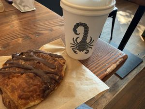 Chocolate croissant and coffee of the day   at Timeless Coffee Roasters and Bakery in Oakland