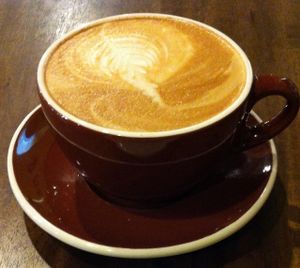 Almond milk latte with a vegan cinnamon roll.  Mmmmm at Seven Mile Cafe in Denton
