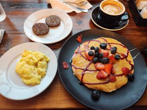 Very berry vegan pancake, Just Egg, and Beyond Meat sausage at Seven Mile Cafe in Denton