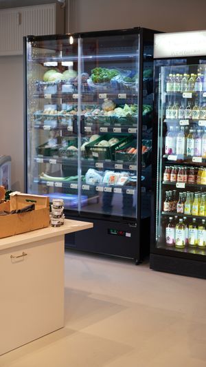 Different types of Kombucha and sodas, juice and smoothies. A large variety of vegetables in the fridge. at Kolibri in Soenderborg