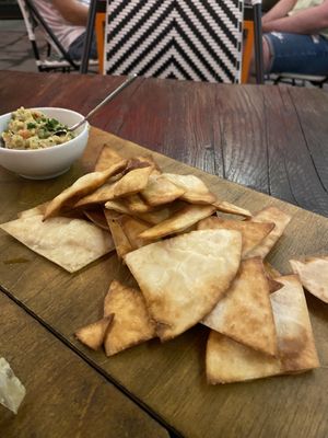 Tortilla chips with guacamole instead of cheese sauce  at Taqueria - Tacos & Drinks in Tallinn