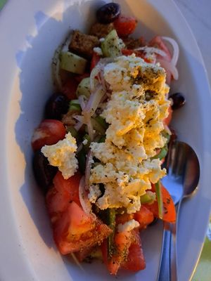 Insalata di pomodori, cipolle, peperoni,cetrioli e feta(si può omettere) at Youkali in Amorgos