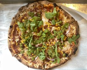 Gaucho pizza: Vegan Chorizo, Vegan Mozzarella, Toasted Corn, Red Onion, Arugula, Red Sauce, Chimichurri finish. Enjoyed with tasty beers, of course 💚  at Saint Paul Brewing in St Paul