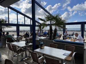 Inside with ocean view  at Strandpaviljoen De Piraat Oostkapelle in Oostkapelle