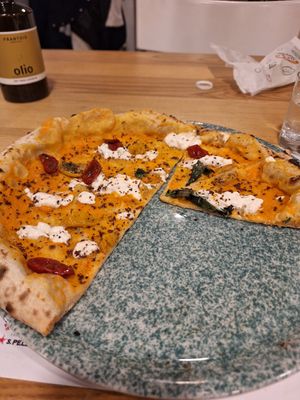 Pumpkin base, red+yellow tomatoes, stracciatella veg, shredded olives at Sunrise Pizza in Caserta