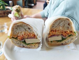 Sourdough baguette with smoked tofu, coleslaw, pickled cucumber, etc. at Kokvrån in Johanneshov