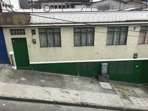 The entrance is opposite the green house in this picture   at Ricuras Integrales Luz in Manizales