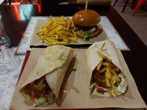 Vegan burrito and spicy onion vegan burger at St. Angus Burger Bar in Corinth