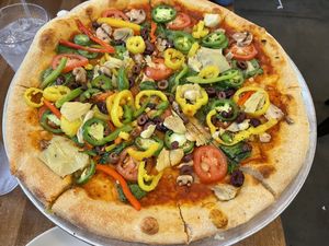 Very veggie pizza no cheeses.  They do have daiya cheese as an option but I personally do not care for Daiya cheese.   at Slice Pizza & Brewhouse in Vestavia Hills