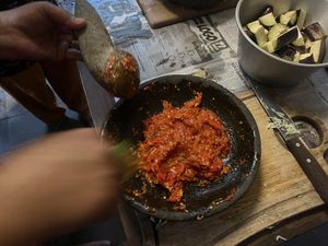 Mortar and pestle making Sambal  at Bu Herni's Cooking Course in Yogyakarta