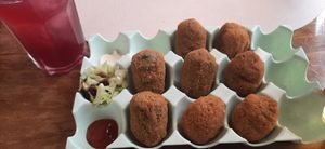 Kroketjes, gevuld met spinazie en champignons at Come ve y Dile in Setenil De Las Bodegas