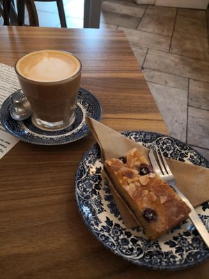 Bakewell tart & oat flat white at Saints Coffee  in Milton Keynes