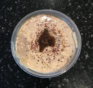 Small tub of hummus to go. Came with a side of warm pita bread which they said was also vegan. Good overall fresh taste. at Gyros Grill in Bloomington