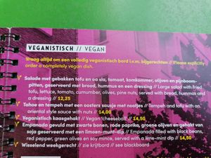 Dinner menu, vegan options include tofu salad, tofu tempeh dish, vegan 'cheeseball', black bean empadana and a weekly changing dish.  at Cafe de Plak in Nijmegen