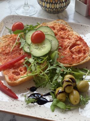 White ciabatta, tomato pesto & tomatoes with salad & olives  at Café Mozart in Mallorca
