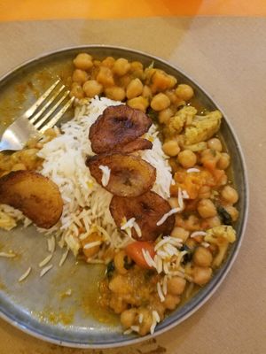 Chickpea and pumpkin curry with rice and fried plantain - delicious! at Flamenkana in Jerez