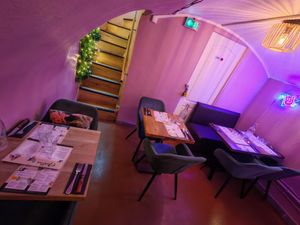 Seats downstairs at Martha Pizze Amore in Paris