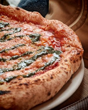 4 fromaggi : tomato sauce, vegan Emmental, paprika cheese, vegan Parmesan, vegan Gorgonzola, and basil pesto at Martha Pizze Amore in Paris