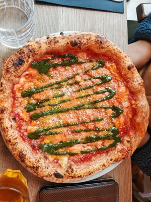 4 fromaggi : tomato sauce, vegan Emmental, paprika cheese, vegan Parmesan, vegan Gorgonzola, and basil pesto at Martha Pizze Amore in Paris
