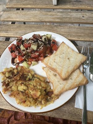 Vegan chickpea omelette with tomato and cucumber salad and bread - very tasty!   at ChikChiki Cafe • ჭიკჭიკი კაფე in Sighnaghi