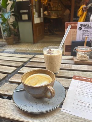 Oatmilk Flat White and delicious peach banana almond milk smoothie!  at Mellow Factory in Antibes
