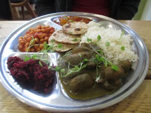 Thali of palak mushrooms, chana masala, beetroot pooriyal, chutney, basmati rice and chapati bread. at The Green Rocket Cafe in Bath