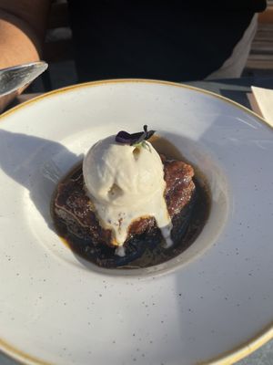 Sticky Toffee Pudding with Vanilla Ice Cream  at The Green Rocket Cafe in Bath