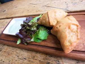 Pumpkin and Celeriac Samosas with watercress raita at The Green Rocket Cafe in Bath